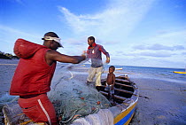 Fishermen prepare gill net, Inhassoro, Mozambique, November 2008