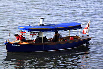 Steam powered boat at the annual Portsoy boat festival, Moray Firth, Scotland, July 2009.