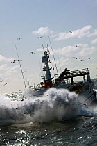 Fishing vessel engulfed by seaspray on the North Sea, July 2009. Property released.