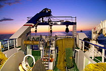Looking aft on a trawler at dusk, North Sea, September 2009. Property released.