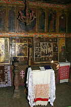 Interior of a traditional wooden church with icons and wooden panelling, on Kizhi Island in Lake Onega, Karelia, N Russia, June 2007.