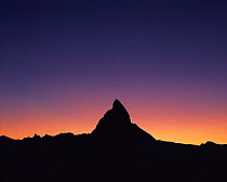 Matterhorn (4,478m) silhouetted at sunset, viewed from Gornergrat, Wallis, Switzerland, September 2008
