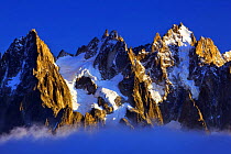 Aiguilles de Chamonix at sunset with clouds rising, Haute Savoie, France, Europe, September 2008. WWE INDOOR EXHIBITION