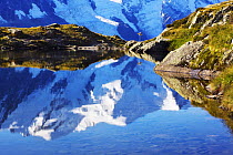 Lacs des Cheserys with Mont Blanc (4,810m) reflected in water, footpath sign on bank, Haute Savoie, France, Europe, September 2008