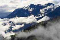View of mountains across the the valley from Kaunergrat visitor's centre with low clouds, near Fliess, Naturpark Kaunergrat, Tirol, Austria, July 2008