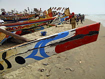 Painted bow of traditional fishing boat, Kafountine, Casamance region, Senegal. April 2008.