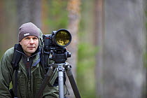 Photographer, Erlend Haarberg, with camera equipment in Bergslagen, Sweden, April 2009