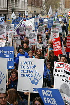 Protesters carrying banners including "I vote to stop climagte chaos", part of 'The Wave' climate change march ahead of the Copenhagen climate summit, London, UK, 5th December 2009