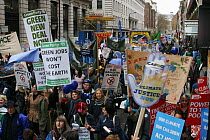Protesters carrying signs / banners ^Green jobs won't cost the earth^ and  ^Climate Justice now^, part of 'The Wave' climate change march ahead of the Copenhagen climate summit, London, UK, 5th Decemb...
