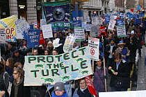 The Wave, climate change march ahead of the Copenhagen climate summit, large sign being carried stating 'Protect the Turtle' London, UK, 5th December 2009