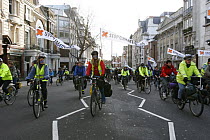 Cyclists, part of The Wave climate change march ahead of the Copenhagen climate summit, with large banners stating 'Stop Climate Chaos' London, UK, 5th December 2009