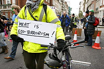 Sign being carried stating 'Meat is Eco-terrorism!' part of The Wave climate change march ahead of the Copenhagen climate summit, London, UK, 5th December 2009