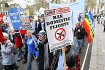 Protesters part of 'The Wave' climate change march ahead of the Copenhagen climate summit, sign stating 'Ban domestic flights' London, UK, 5th December 2009
