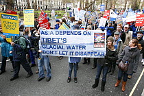 Protesters, part of 'The Wave' climate change march ahead of the Copenhagen climate summit, large sign stating 'Asia depends on Tibet's glacial water, don't let it disappear' London, UK, 5th December...