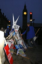 Protest signs left in a pile, after 'The Wave' climate change march ahead of the Copenhagen climate summit, London, UK, 5th December 2009