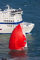 Ferry and "Veolia Environment" (Roland Jourdain and Jean-Luc Nelias) at the start of the Transat Jacques Vabre race, departing Le Havre, France. 8th November 2009.