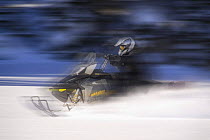 Snowmobiling in the Bridger - Teton National Forest on Togwotee Pass near Dubois, Wyoming. Model released, January 2009