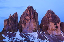 Tre Cime di Lavaredo peaks at dawn, Sexten Dolomites, South Tyrol, Italy, Europe, July 2009