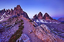 Paternkofel (left) and Tre Cime di Lavaredo mountains at dawn, Sexten Dolomites, South Tyrol, Italy, Europe, July 2009