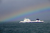 Rainbow over passenger ferry Seafrance 'Nord Pas De Calais' crossing English channel, March 2009