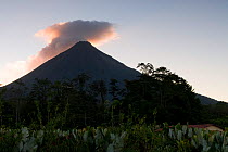 Arenal Volcano at sunset, clouds mixing with smoke, Costa Rica, February 2009