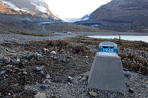 Marker showing where the Athabasca Glacier ended in 1948, the glacier now far in the distance, Columbia Icefield, Jasper National Park, Rocky Mountains, Alberta, Canada, September 2009