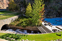 Hot mineral water flowing from the mountain into the Radium Hot Springs mineral pool, Kootenay National Park, Rocky Mountains, British Columbia, Canada, September 2009