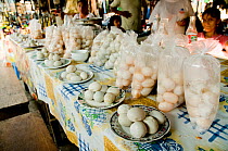 Eggs of Yellow-spotted Amazon river turtle {Podocnemis unifilis} and Giant South American / arrau turtle {Podocnemis expansa} for sale on market stall, Nanay, Iqutios, Peruvian amazon, Peru, August 20...