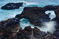 Waves breaking on rocky shore, creating natural swimming pools, El Charco azul, near Puerto Espindola, La Palma, Canary Islands, Spain, March 2009