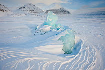 Ice formation in the Temple fjord with Von Post glacier in the background, West coast of Spitsbergen, Svalbard, Norway, March 2009