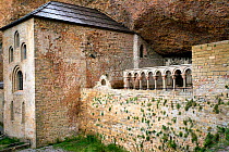 Old monastery of San Juan de la Pena under cliffs, Aragon, Spain. July 2008.