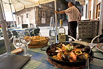 Paella dish in a Vigo restaurant, Galicia, Spain. July 2008.