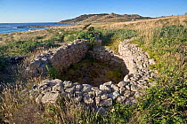 Remains of ancient wolf-trap at Cabo Vilan, Galicia, Spain. Note the two V-shaped walls, where the wolves were driven by hunting parties into the trap. July 2008.