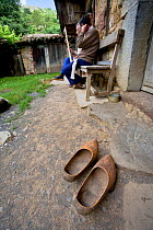 Wooden shoes on doorstep of home, Villanueva village. Somiedo Natural reserve, Asturias, Spain. July 2008.