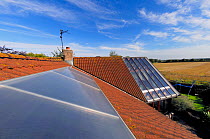 Solar panels on  house roof, Paxton, Berwickshire, Scotland, July