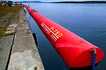 Pelamis wave energy convertor moored by Lyness Pier, Hoy, Orkney, Scotland, July