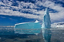 RF- Iceberg reflected in sea, Fournier Bay, Antarctica. (This image may be licensed either as rights managed or royalty free.)