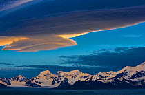 Mountains at sunset with lenticular clouds in the sky, South Georgia, January 2006