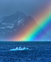 Rainbow over the sea with a small iceberg, South Georgia, December 2006