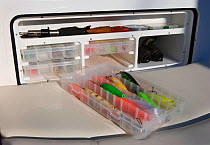 Fishing floats and storage compartment aboard a boat.