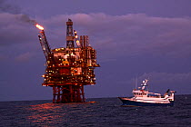 Fishing vessel "Harvester" beside an oil platform on the North Sea, October 2009.