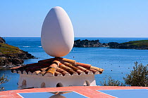 Egg-shaped sculpture balanced on roof at Salvador Dali's House-Museum. Port Lligat, Cap de Creus Natural Park, Gerona, Catalonia, Spain. March 2009.