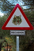 Road traffic warning sign for the conservation of Spanish lynx (Lynx pardina). Sierra de Andujar Natural Park, Jaen, Spain. 2009.