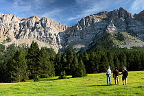 Three people hiking in Cadi-Moixero Natural Park, Lerida, Catalonia, Spain. July 2009.