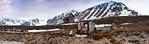 Derelict remains of an old mineral mining hut and rail wagon stock, Shorline, Northern Spitsbergen, Svalbard, Arctic Norway, June 2009