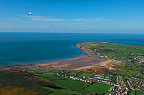 Aerial view of Woolacombe beach with a paraglider flying, North Devon, UK, October 2009
