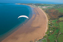 Aerial view of a paraglider over Woolacombe beach, North Devon, UK, October 2009