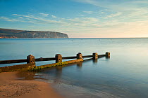 Swanage bay (Blue Flag beach) with groyne in early morning. Dorset, UK. September 2009.