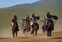 Re-enactement of an attack by the mounted armies of Genghis Khan (emperor of the Mongol Empire) carrying bows and arrows, during the Genghis Khan Show, in Ulaanbaatar, Mongolia. The horses are Mongoli...