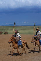 Mounted soldiers from the armies of Genghis Khan (emperor of the Mongol Empire) during the Genghis Khan Show, in Ulaanbaatar, Mongolia. The horses are Mongolian horses. July 2007